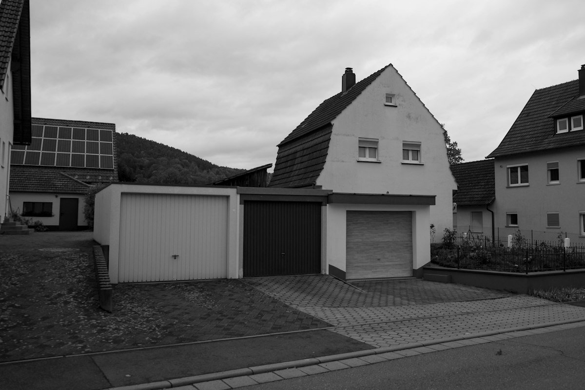 Three residential garage doors — styles ready for automation